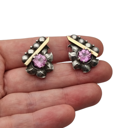 Art Deco silver earrings with gold accents and faceted pink stones, circa 1930–1940