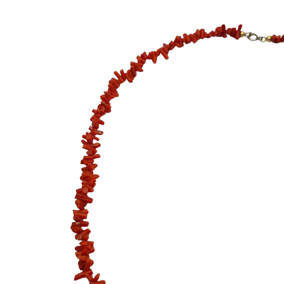 Boho necklace of natural red coral with irregular branches and metal clasp, circa 1970-80