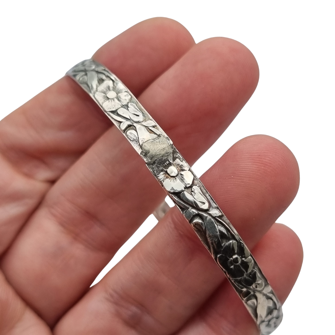 Vintage silver bracelet with embossed floral design circa 1950