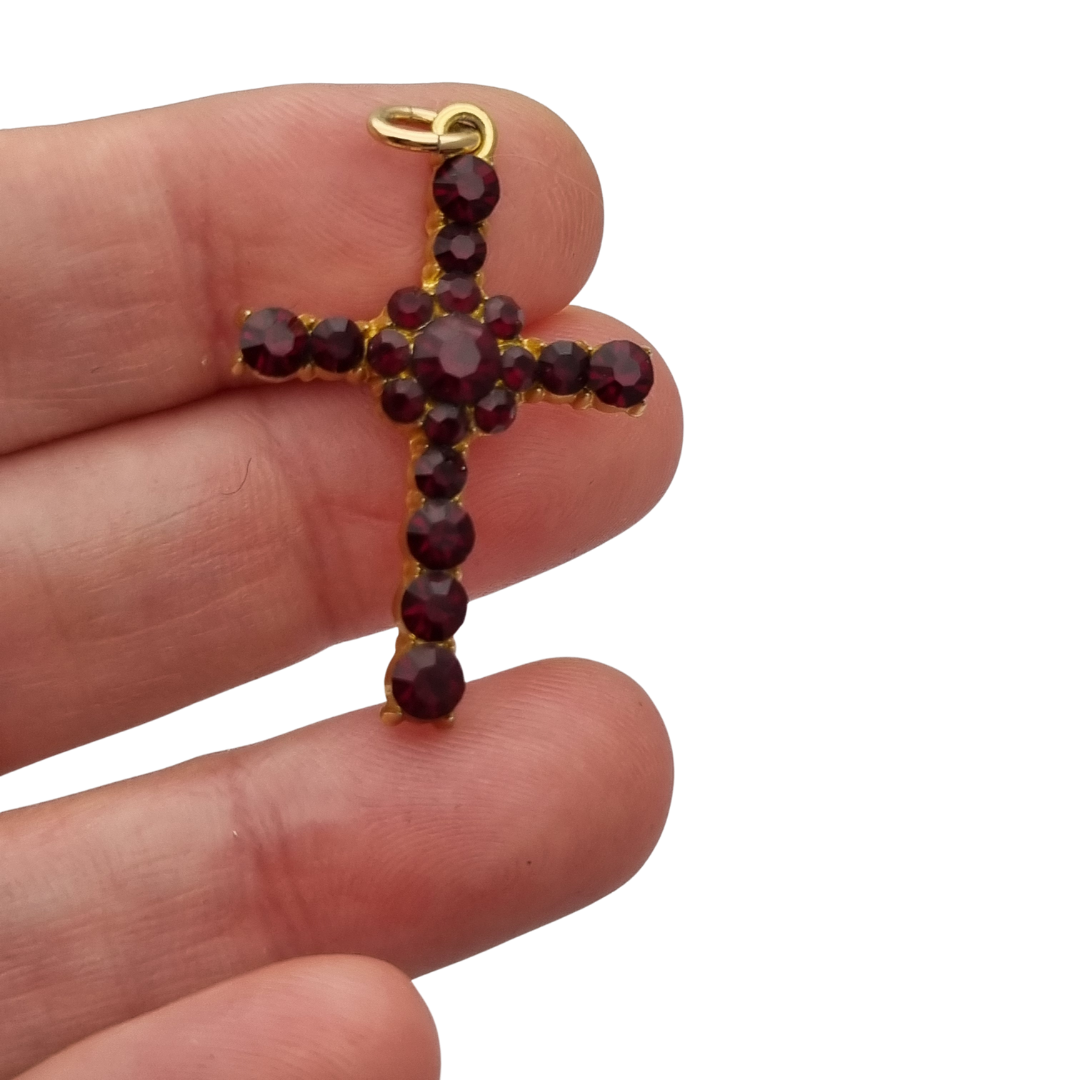 Vintage cross with garnet rhinestones and gold-tone metal religious style circa 1950