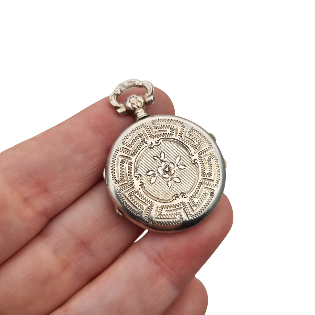 Victorian silver locket with European floral engraving, circa 1910