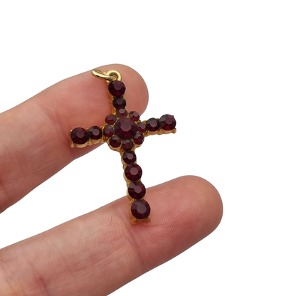 Vintage cross with garnet rhinestones and gold-tone metal religious style circa 1950