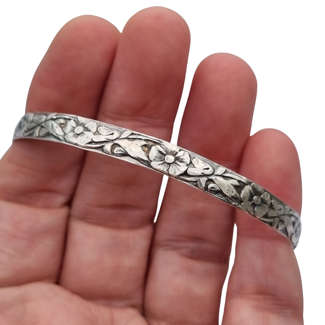 Vintage silver bracelet with embossed floral design circa 1950