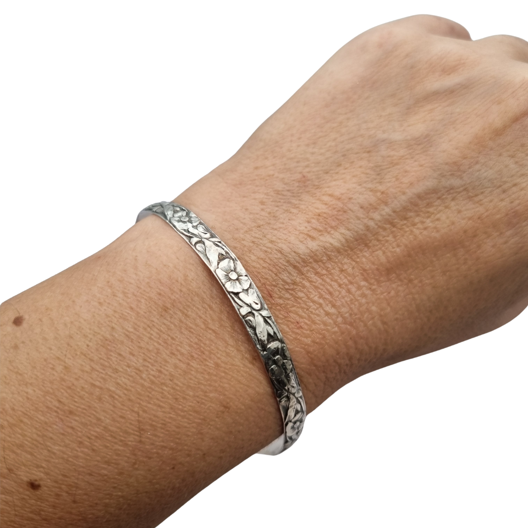 Vintage silver bracelet with embossed floral design circa 1950