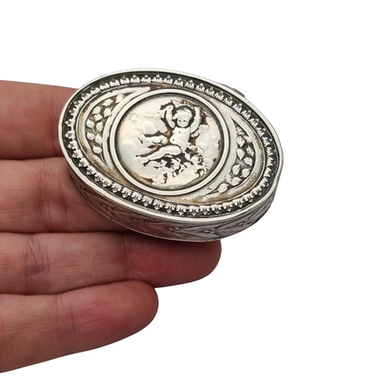 Belle Époque silver box with cherub, Louis XVI Revival decoration, and remains of gilding, Europe, ca. 1895–1915