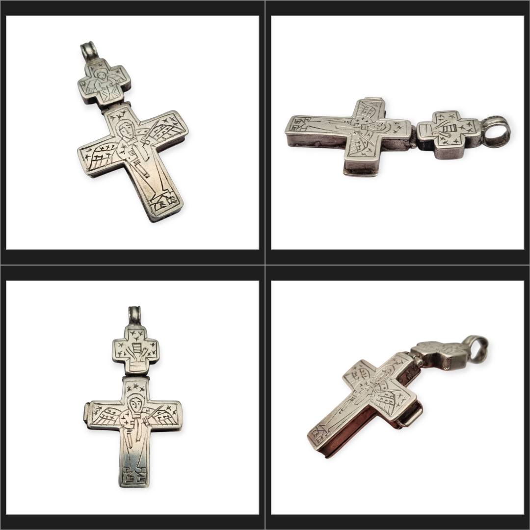 Antique Byzantine-style silver reliquary cross with engraved religious scenes.