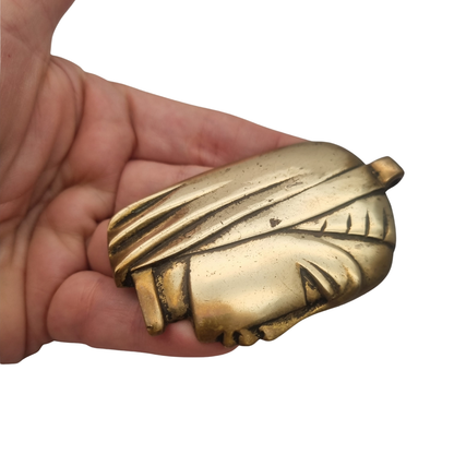 Gran colgante escultórico de bronce con cabeza femenina estilizada, circa 1980-1990