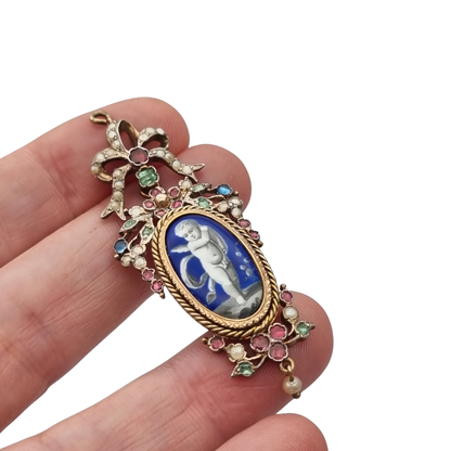 Antique winged cherub pendant in Gilt Silver with Enamel, Pearls, and Gems, ca. 18 70–1890