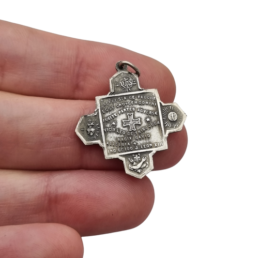 Catholic devotional silver-tone metal Saint Anthony of Padua cross medal, circa 1970