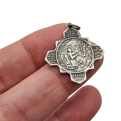 Catholic devotional silver-tone metal Saint Anthony of Padua cross medal, circa 1970