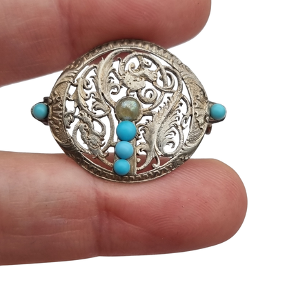 Broche vintage boho étnico de plata con cuentas azules y calado vegetal, años 70-80