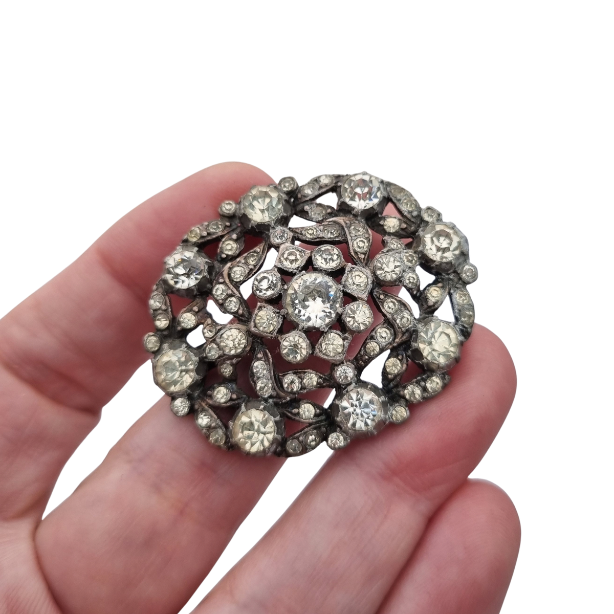 Vintage Art Deco costume jewelry brooch with rhinestones and floral decoration, Hollywood style, Europe, ca. 1940–1950