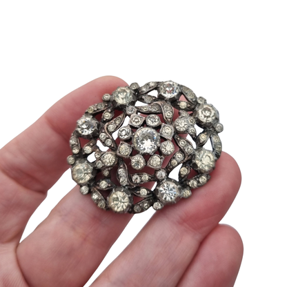 Vintage Art Deco costume jewelry brooch with rhinestones and floral decoration, Hollywood style, Europe, ca. 1940–1950