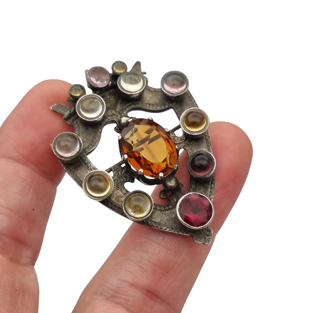 Victorian Scottish Luckenbooth brooch in silver with polychrome and Cairngorm quartzes, registered design 1866