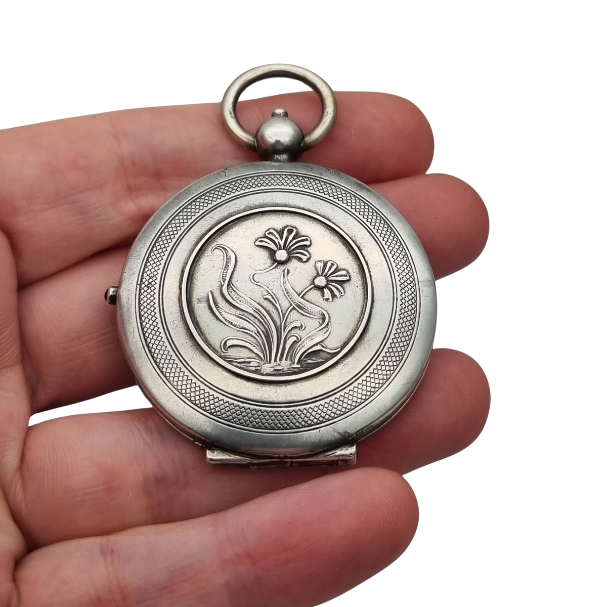 Guardapelo Art Nouveau antiguo de plata 800 con doble portarretrato, grabado floral y piedra rosa, ca. 1900