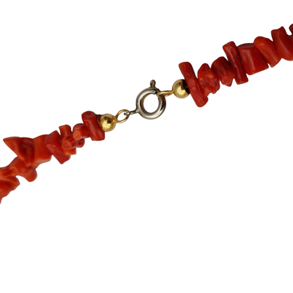 Boho necklace of natural red coral with irregular branches and metal clasp, circa 1970-80