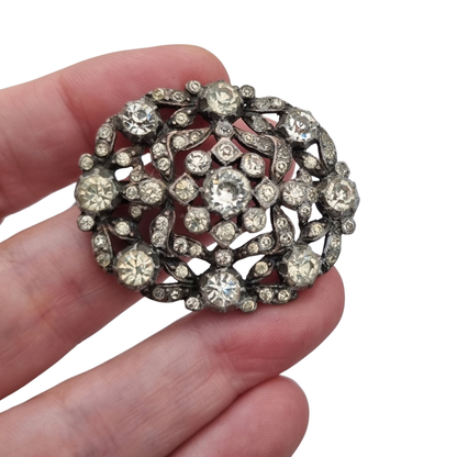 Vintage Art Deco costume jewelry brooch with rhinestones and floral decoration, Hollywood style, Europe, ca. 1940–1950