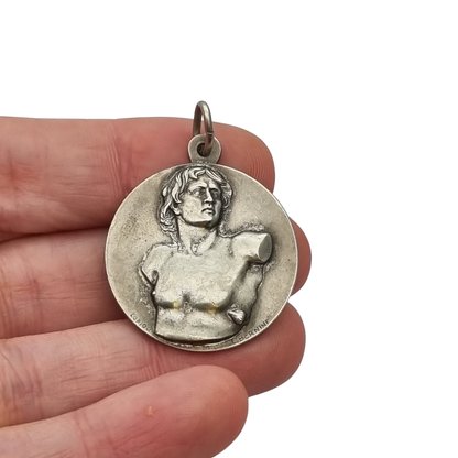 Vintage relic medal of Saint Sebastian from the Catacombs of Rome with early Christian symbols, Italy, ca. 1950–1960