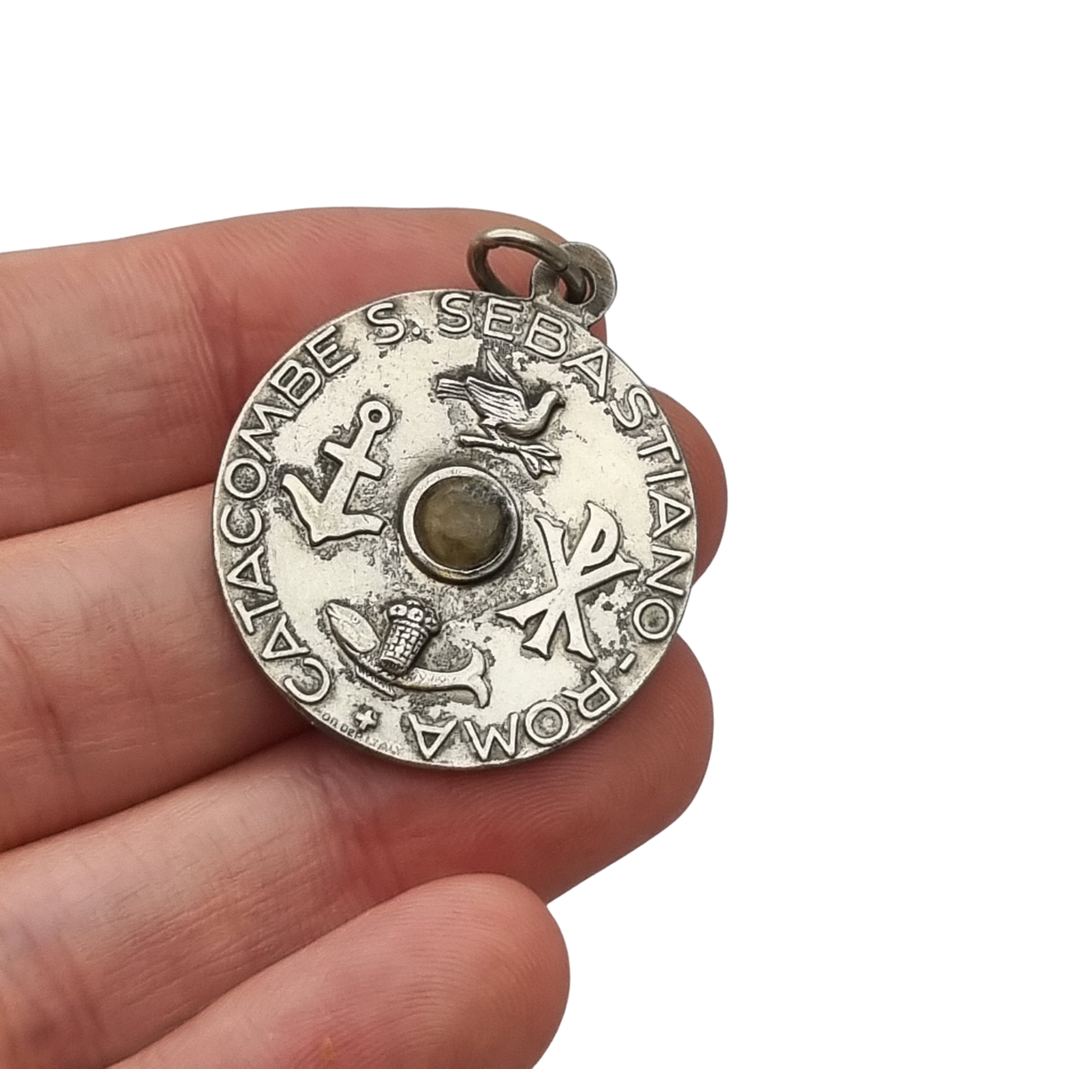 Vintage relic medal of Saint Sebastian from the Catacombs of Rome with early Christian symbols, Italy, ca. 1950–1960