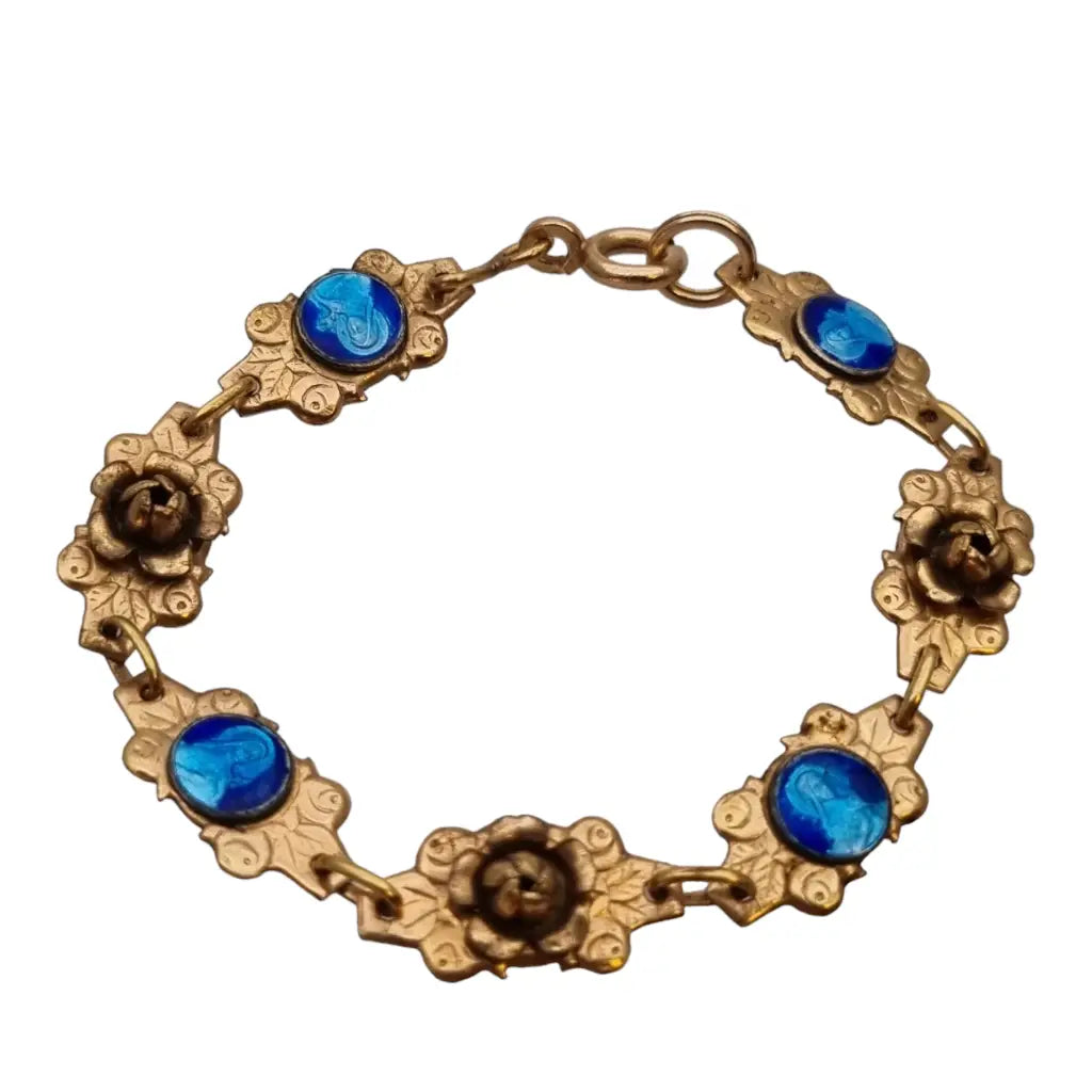 Pulsera religiosa antigua dorada para niña con medallas de esmalte azul.