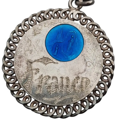 Medalla religiosa de la virgen lourdes francia 1959 en plata y esmalte azul.