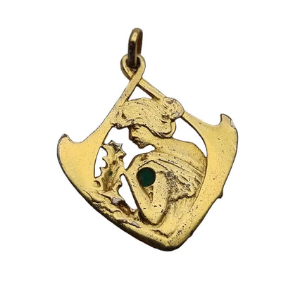 Colgante art nouveau en plata dorada con mujer y piedra verde estilo modernista