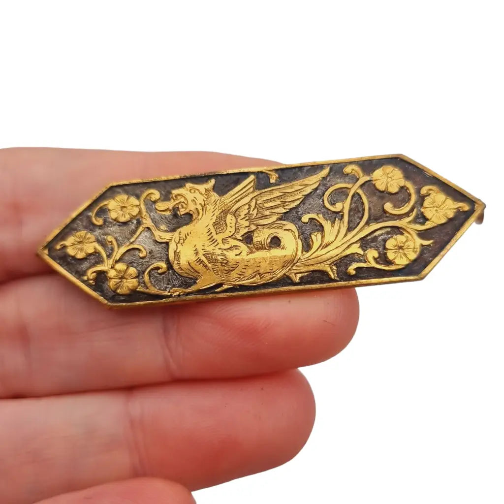 Broche dorado de dragon antiguo pin floral alargado para coleccionistas.