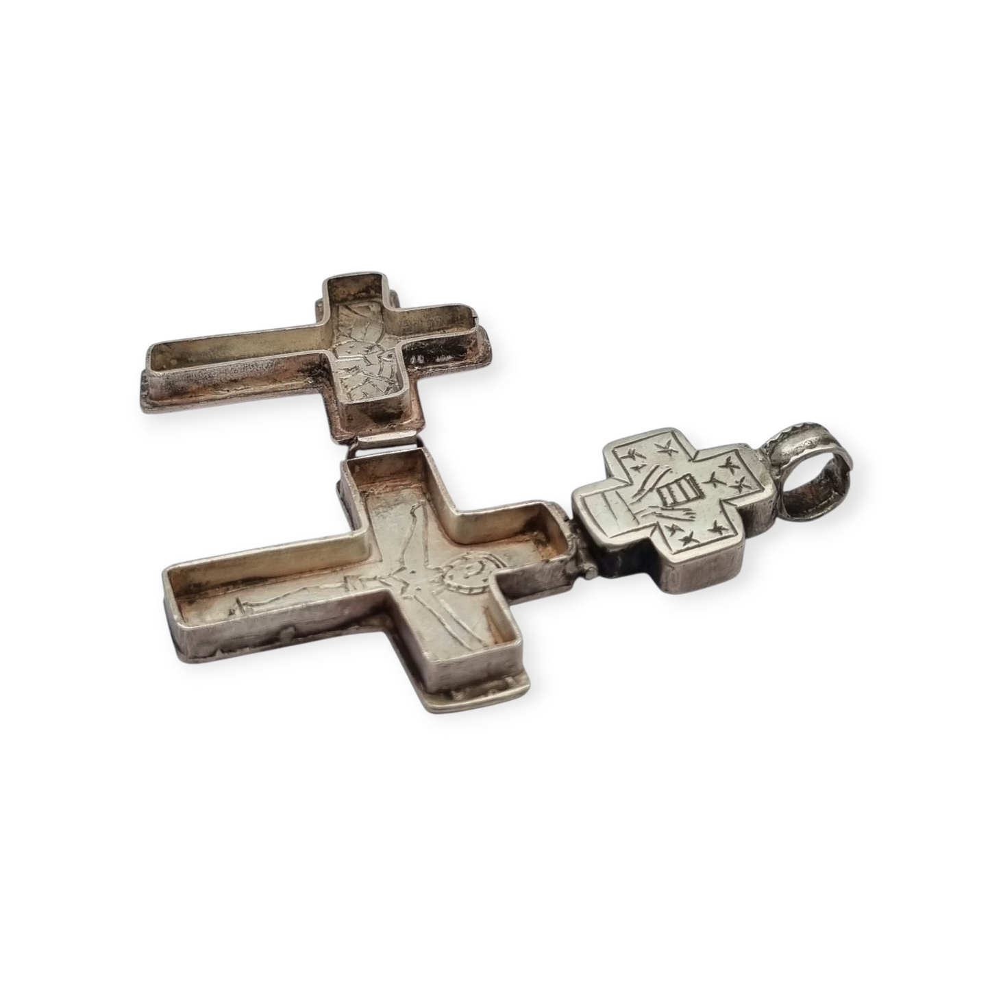 Antique Byzantine-style silver reliquary cross with engraved religious scenes.
