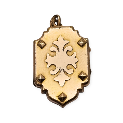 Victorian locket in gilt metal, engraved in the shape of a shield, circa 1900