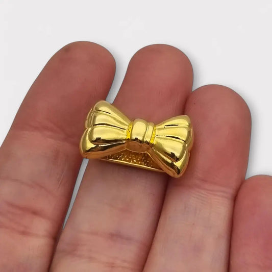 Acortador de collar con lazo dorado elegante y funcional años 80. Gargantilla