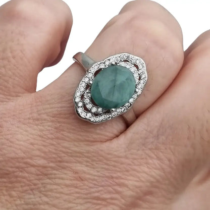 Anillo vintage de plata 925 con piedra verde oval y orla circonitas años