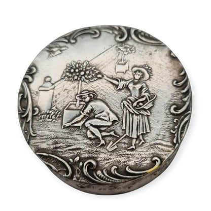 Antigua caja redonda alemana de plata 800 con escena bucólica jardín