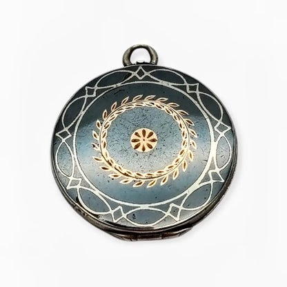 Antiguo Guardapelo redondo nielado en plata con grabado geométrico 1910–1920