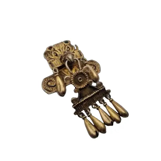 Broche azteca mixteca de plata del dios sol tumba 7 monte albán oxaca.