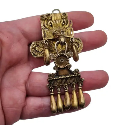 Broche azteca mixteca de plata del dios sol tumba 7 monte albán oxaca.