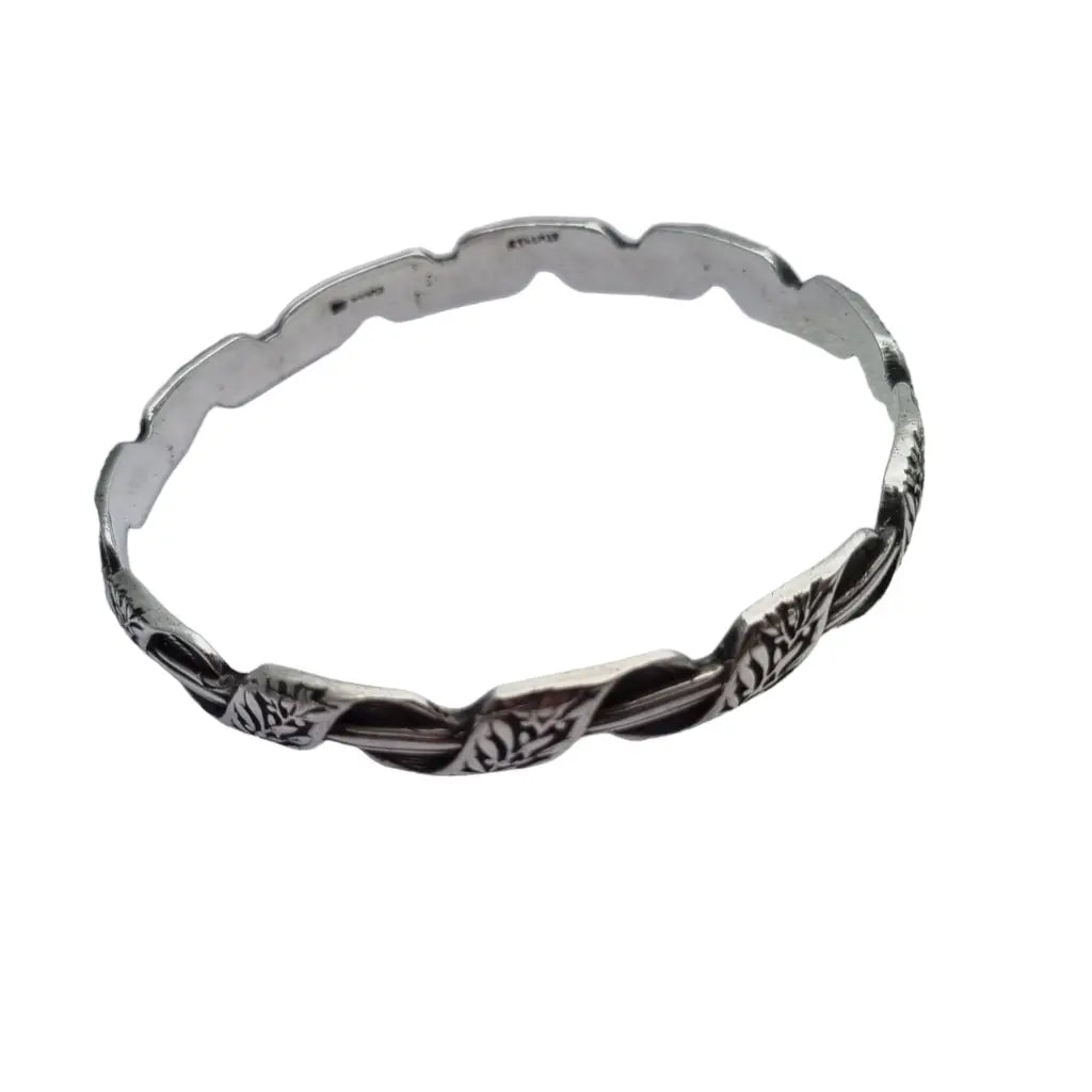 Brazalete antiguo rígido de plata k. Thamar con decoración floral para mujer.