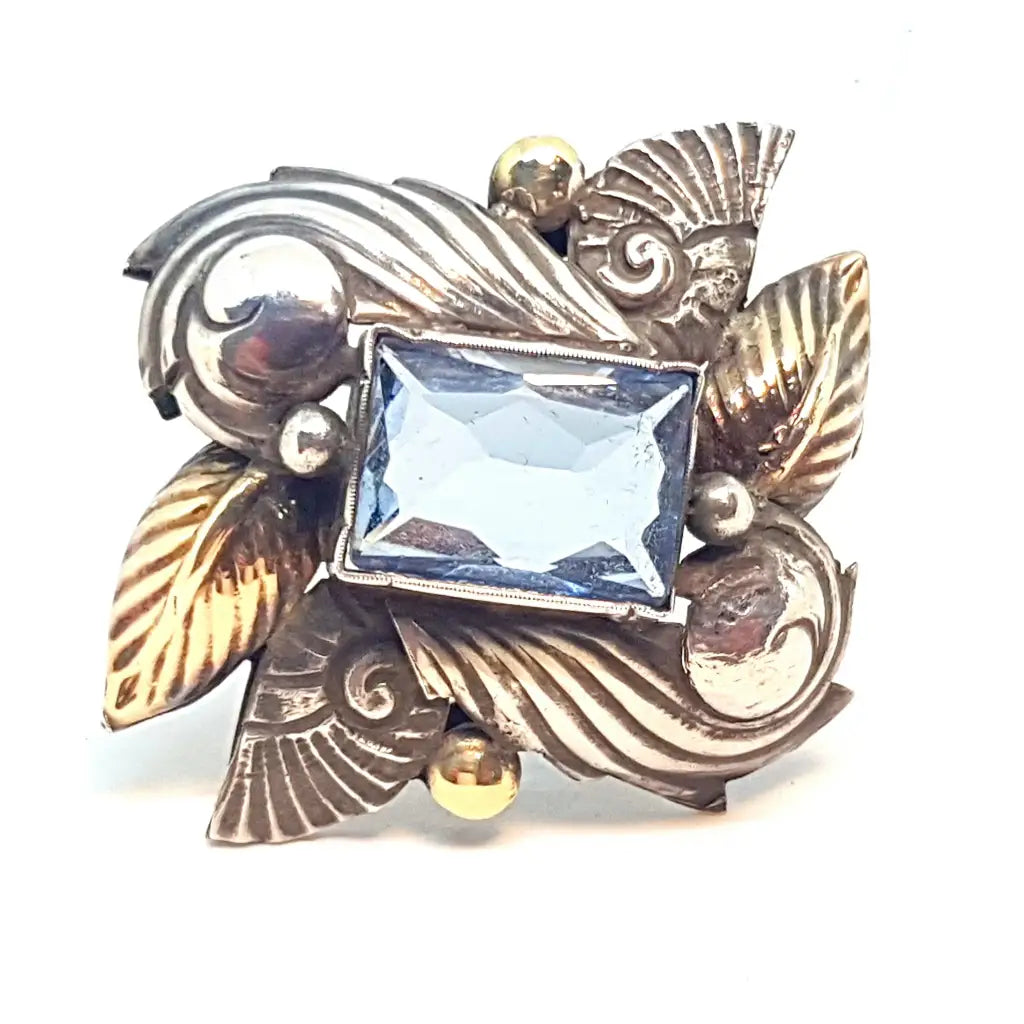 Broche alfiler Art Deco de plata antigua con oro laminado imitación aguamarina