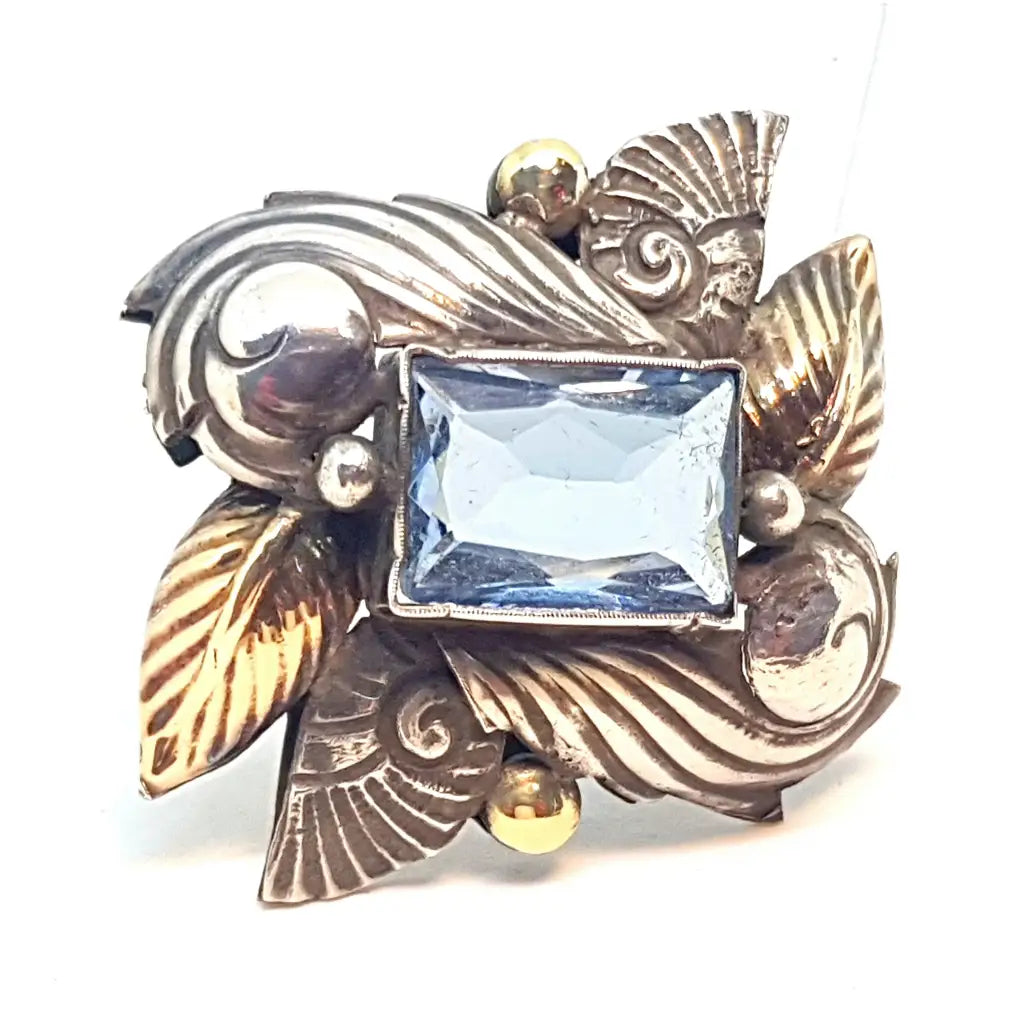 Broche alfiler Art Deco de plata antigua con oro laminado imitación aguamarina