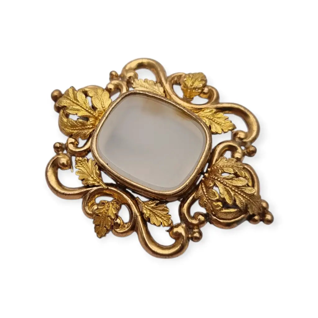 Broche antiguo dorado Art Nouveau con piedra blanca central Joyería modernista