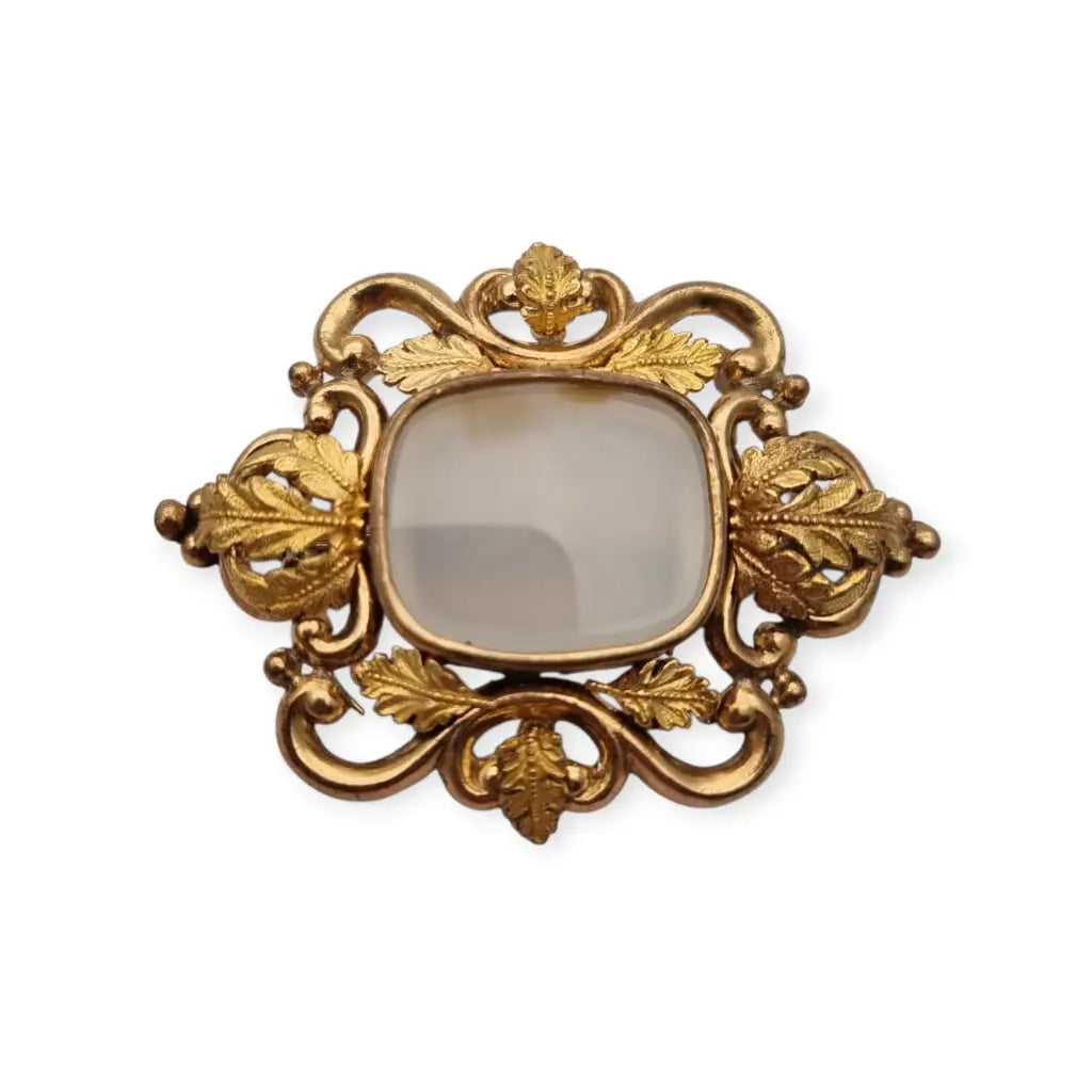 Broche antiguo dorado Art Nouveau con piedra blanca central Joyería modernista