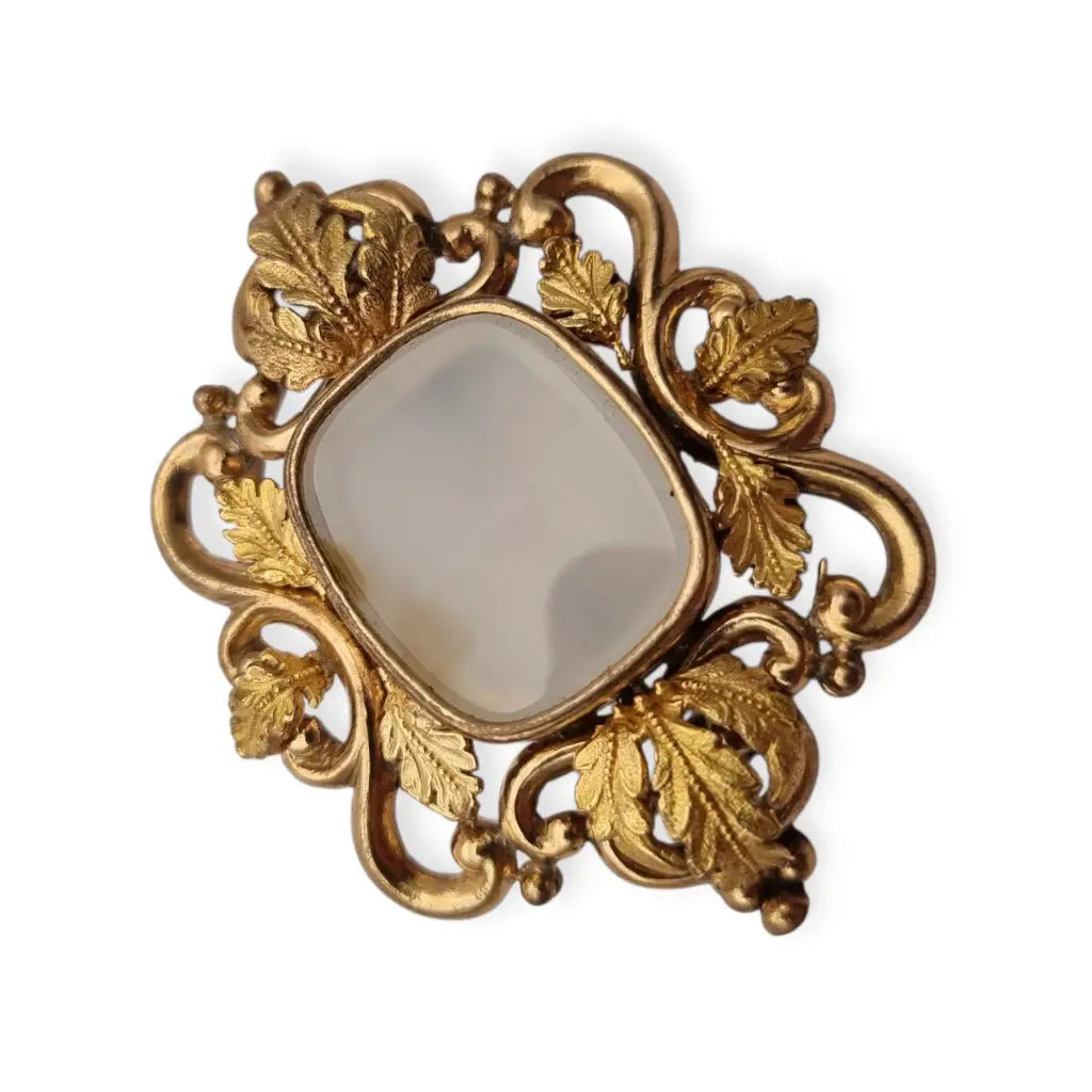Broche antiguo dorado Art Nouveau con piedra blanca central Joyería modernista