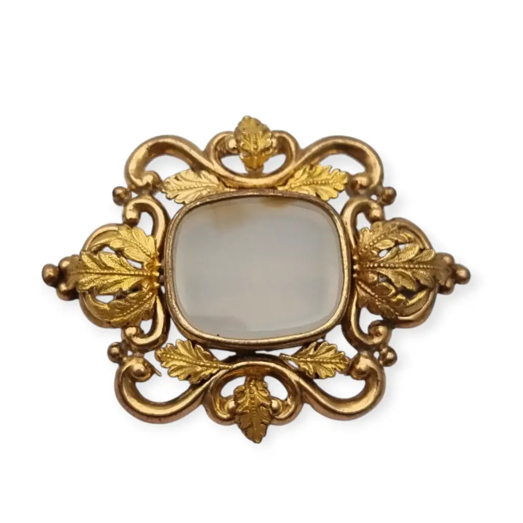 Broche antiguo dorado Art Nouveau con piedra blanca central Joyería modernista
