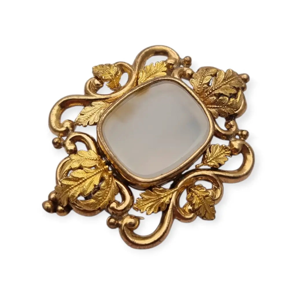 Broche antiguo dorado Art Nouveau con piedra blanca central Joyería modernista