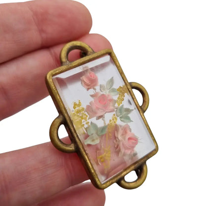 Broche Art Déco rectangular vintage con flores en lucita de los años 40.