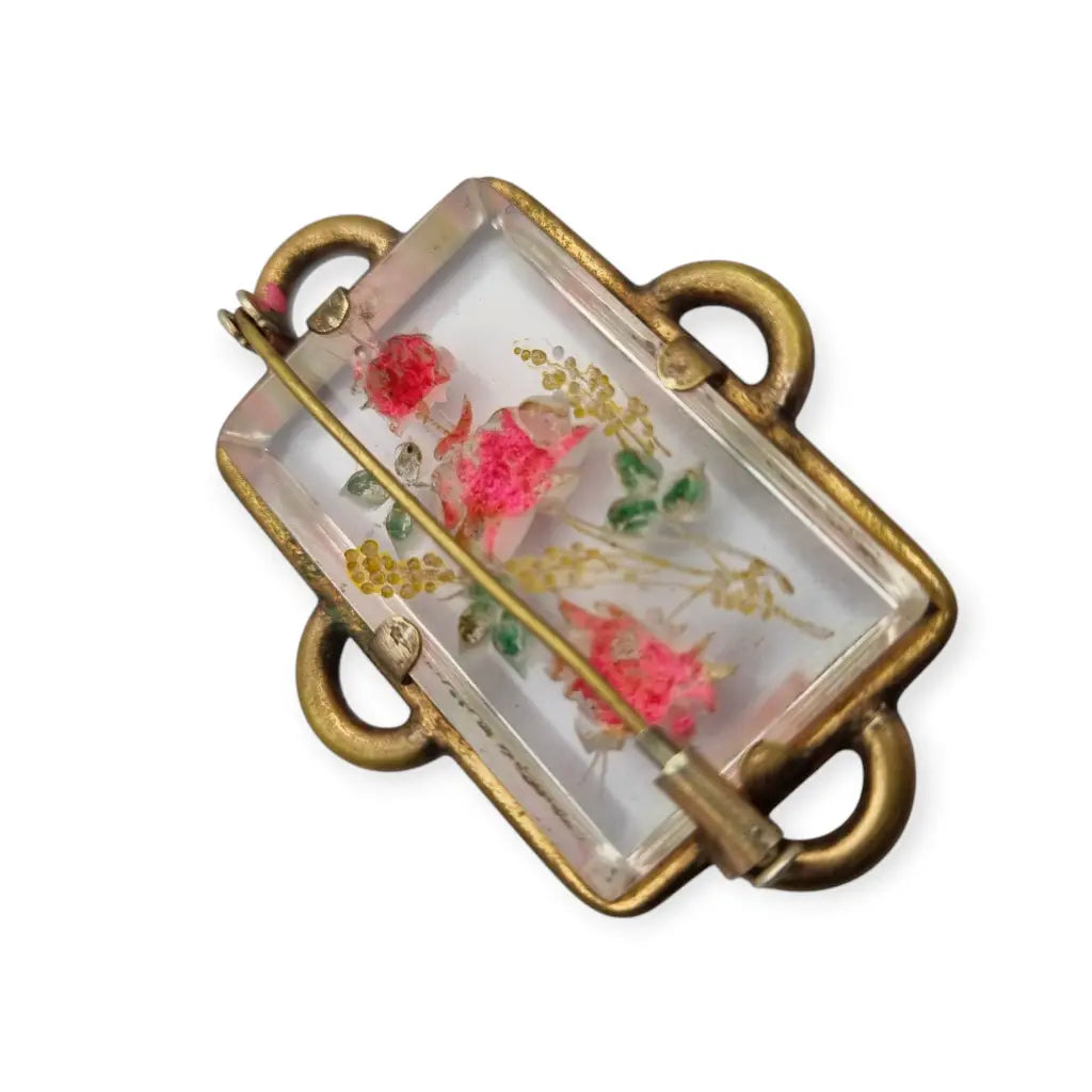 Broche Art Déco rectangular vintage con flores en lucita de los años 40.