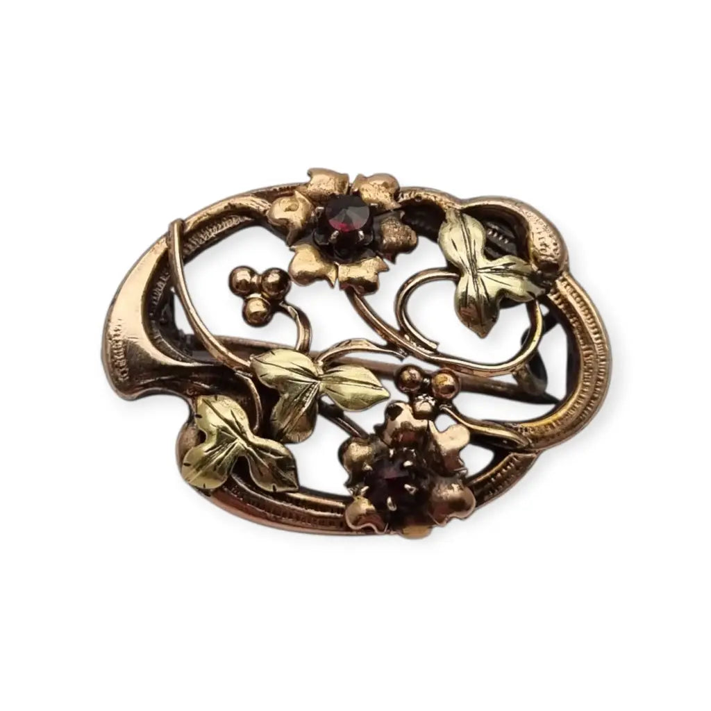 Broche Art Nouveau floral en oro laminado y rosa con granates el sello