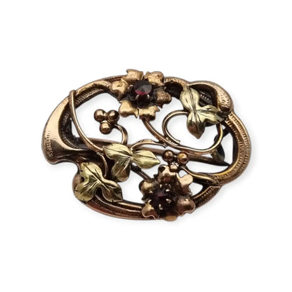 Broche Art Nouveau floral en oro laminado y rosa con granates el sello