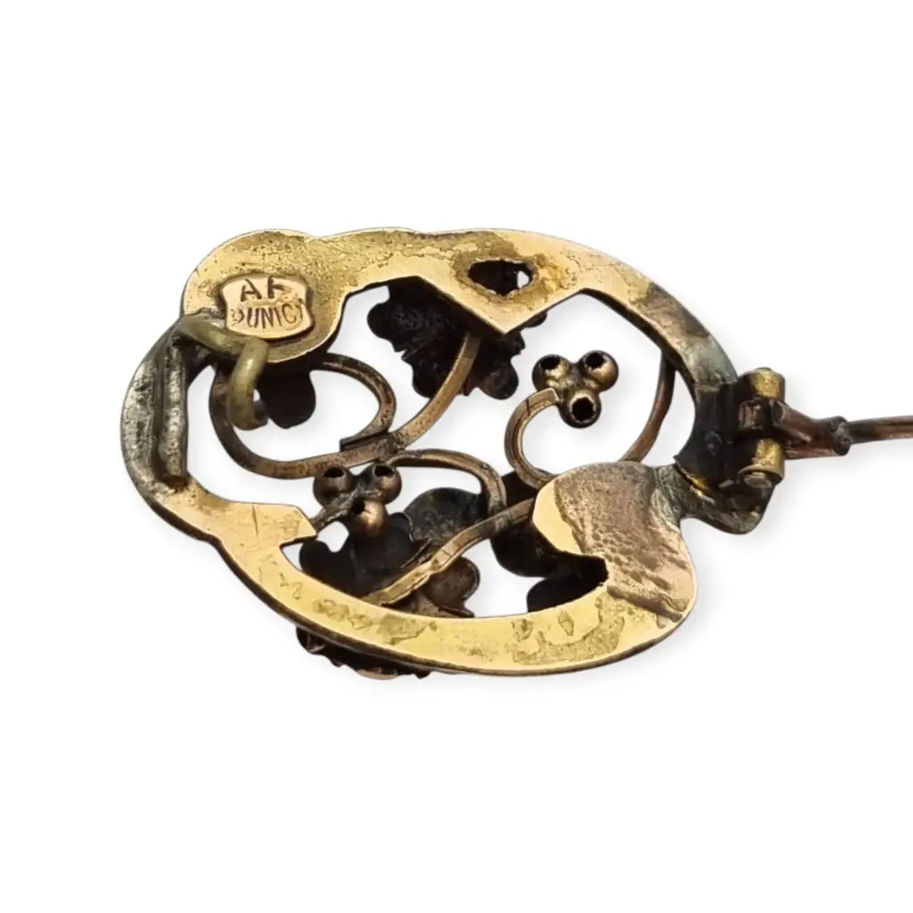 Broche Art Nouveau floral en oro laminado y rosa con granates el sello