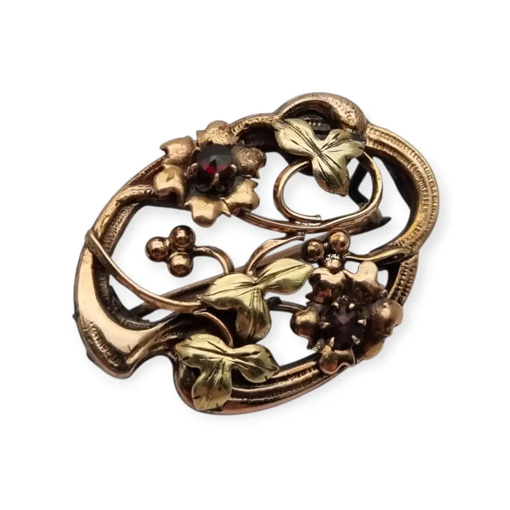 Broche Art Nouveau floral en oro laminado y rosa con granates el sello