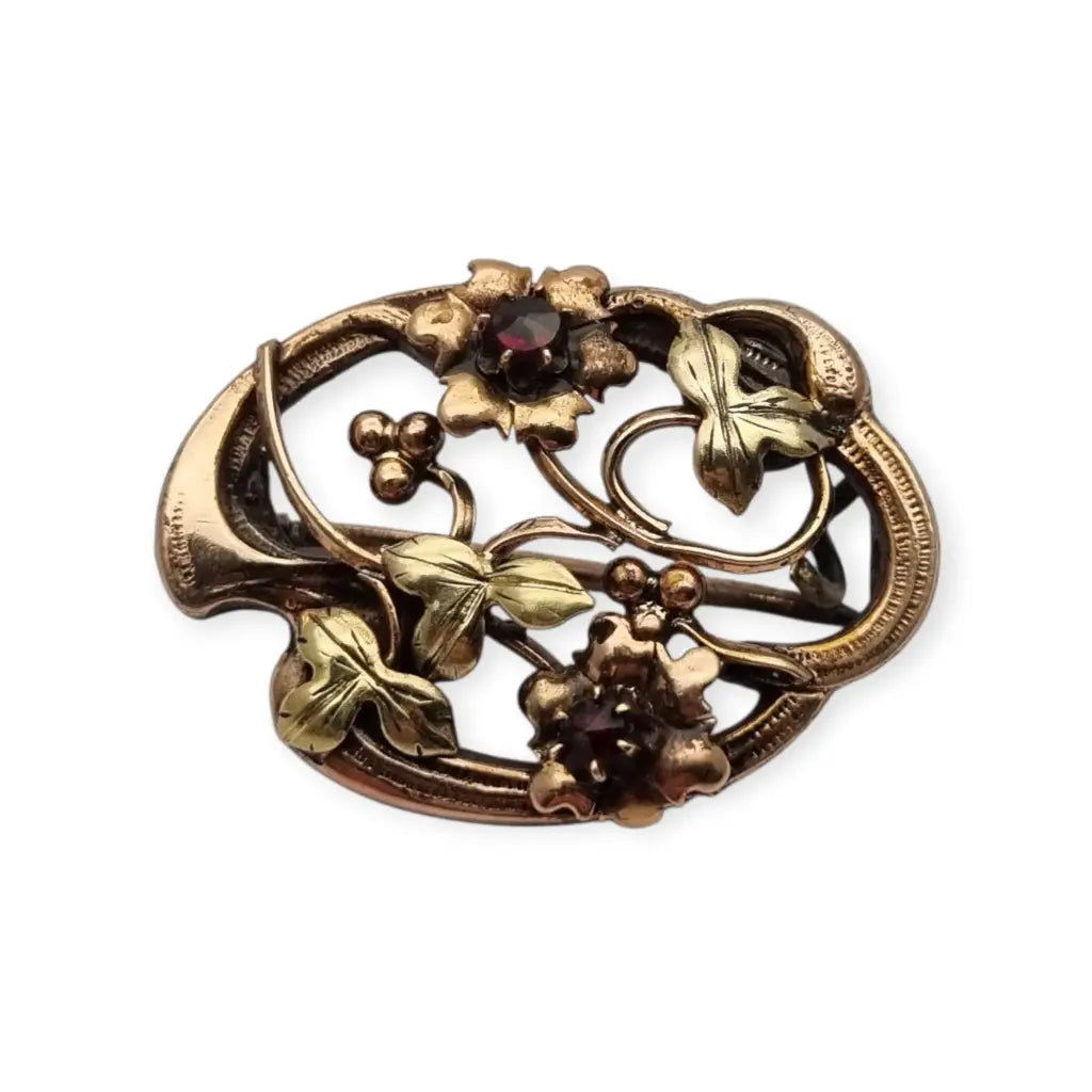 Broche Art Nouveau floral en oro laminado y rosa con granates el sello